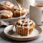 Protein-Packed Cinnamon Roll Muffins with Oat Flour & Glaze